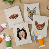 The four finished Collie and Chihuahua mini canvases laid out on a table