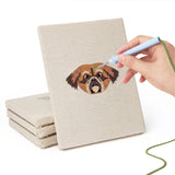 Hand punching one of the Collie and Chihuahua mini canvases