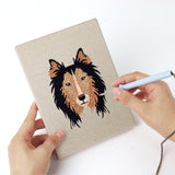 Punching a Collie and Chihuahua mini canvas with the punch needle