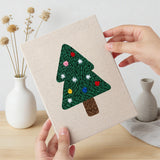 Hand holding a finished Colorful Christmas Trees mini canvas