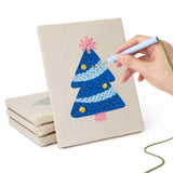 Hand punching one of the Colorful Christmas Trees mini canvases