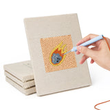 Hand punching one of the Comet and Planets mini canvases