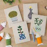 The four finished Cool Tone Planters mini canvases laid out on a table