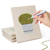 Hand punching one of the Cool Tone Planters mini canvases
