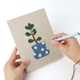 Punching a Cool Tone Planters mini canvas with the punch needle