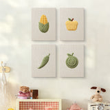 The four Corn and Cabbage mini canvases on a wall above a shelf
