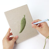 Punching a Corn and Cabbage mini canvas with the punch needle
