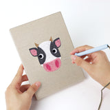 Punching a Cow and Buffalo mini canvas with the punch needle