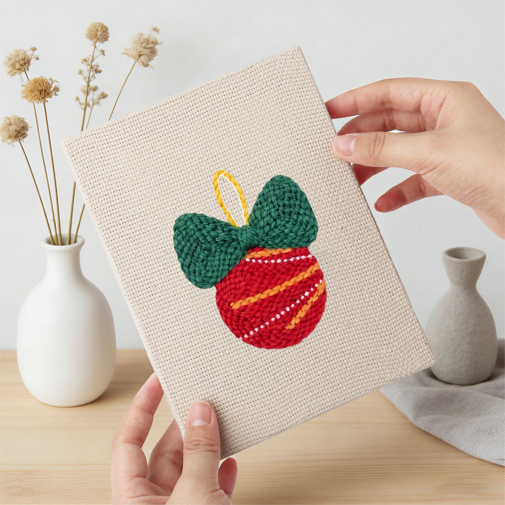 Hand holding a finished Cozy Christmas mini canvas