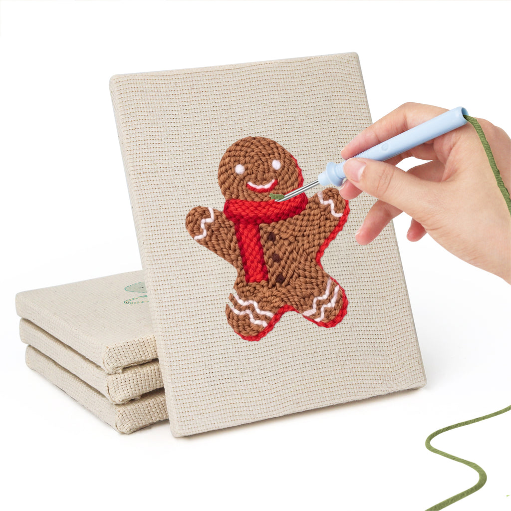 Hand punching one of the Cozy Christmas mini canvases