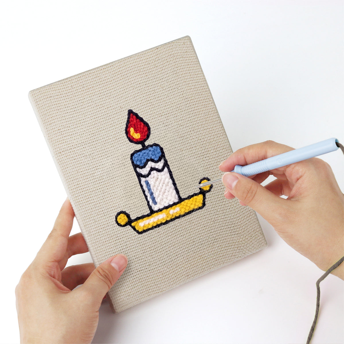 Punching a Cozy Christmas mini canvas with the punch needle