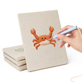 Hand punching one of the Crab and Angelfish mini canvases