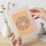 Hand holding a finished Cupcake and Donut mini canvas