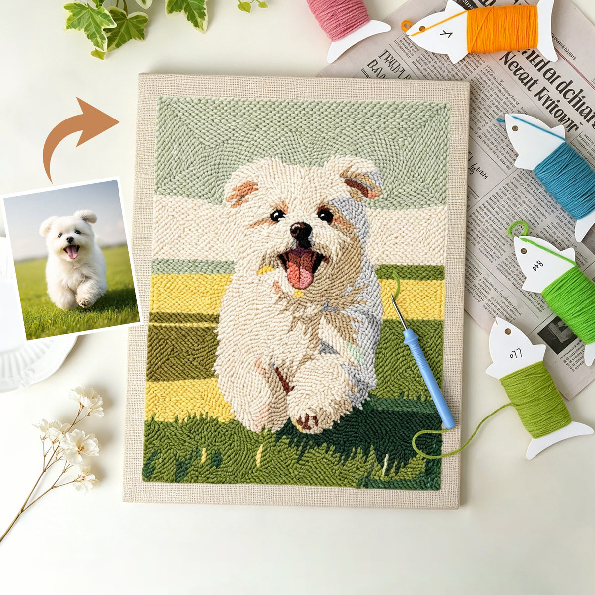 Custom punch needle canvas of a small white dog next to the original photo