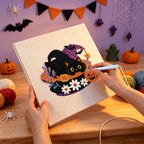 Punching the Daisy Hat Cat design with the punch needle