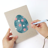 Punching a Daisy Star Eggs mini canvas with the punch needle