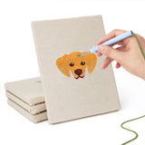 Hand punching one of the Dalmatian and Pals mini canvases