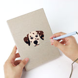 Punching a Dalmatian and Pals mini canvas with the punch needle