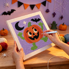 Punching the Dancing Jack-o'-Lantern design with the punch needle