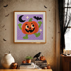 Finished Dancing Jack-o'-Lantern punch needle canvas on a wall