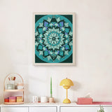 Finished Deep Teal Mandala punch needle canvas on a wall
