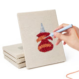 Hand punching one of the Desk Essentials mini canvases