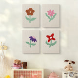 The four Doodle Flowers mini canvases on a wall above a shelf