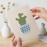 Hand holding a finished Dotted Pot Succulents mini canvas