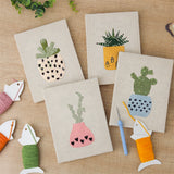 The four finished Dotted Pot Succulents mini canvases laid out on a table