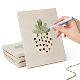 Hand punching one of the Dotted Pot Succulents mini canvases
