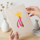 Hand holding a finished Dress Up Favorites mini canvas