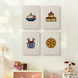 The four Drumstick Dinner mini canvases on a wall above a shelf