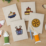 The four finished Drumstick Dinner mini canvases laid out on a table