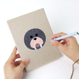 Punching a Duck and Walrus mini canvas with the punch needle