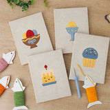 The four finished Easter Table Treats mini canvases laid out on a table