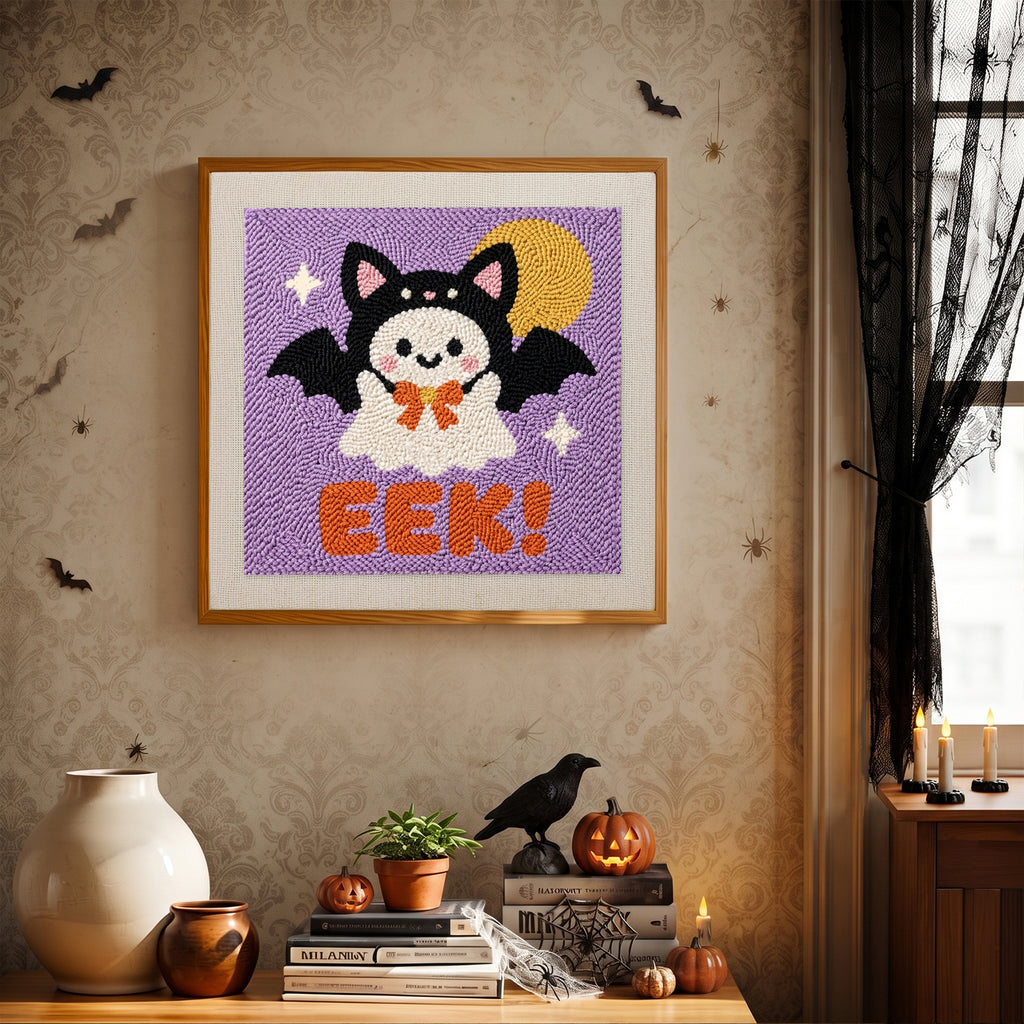 Finished Eek Bat Ghost punch needle canvas on a wall