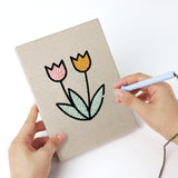 Punching a Egg Basket Spring mini canvas with the punch needle