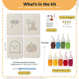 What is in the Fangs and Ghost set: 4 printed canvases, punch needle, threader, threads, color guide and 4 sets of hangers (6 × 8 in (15 × 20 cm) each)
