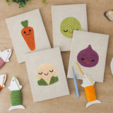 The four finished Fig and Cauliflower mini canvases laid out on a table