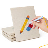 Hand punching one of the First Day Backpack mini canvases