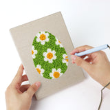 Punching a Floral Easter Eggs mini canvas with the punch needle