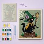 Flower Hat Witch Cat canvas before and after punching, with the threads and tools