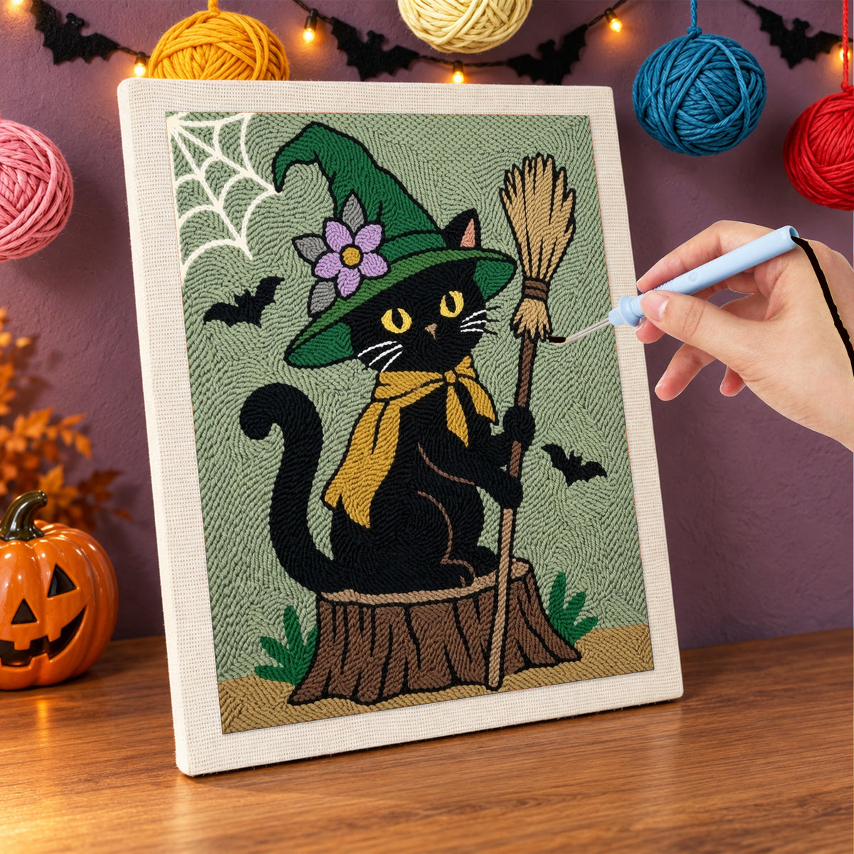 Punching the Flower Hat Witch Cat design with the punch needle
