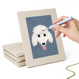Hand punching one of the Fluffy Friends mini canvases