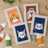 The four finished Fluffy Pet Portraits mini canvases laid out on a table