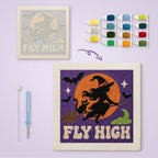 Fly High Witch canvas before and after punching, with the threads and tools