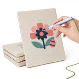 Hand punching one of the Folk Bunny Blooms mini canvases