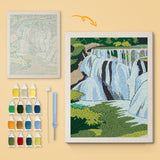 Forest Waterfall canvas before and after punching, with the threads and tools