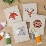 The four finished Fox and Deer mini canvases laid out on a table