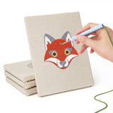 Hand punching one of the Fox and Deer mini canvases